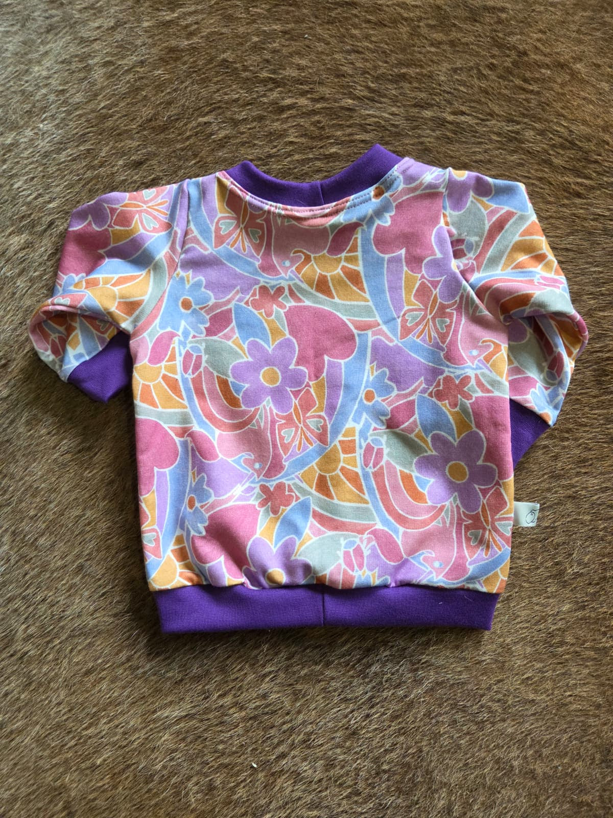 achterkant van longsleeve met eenhoorns, roze