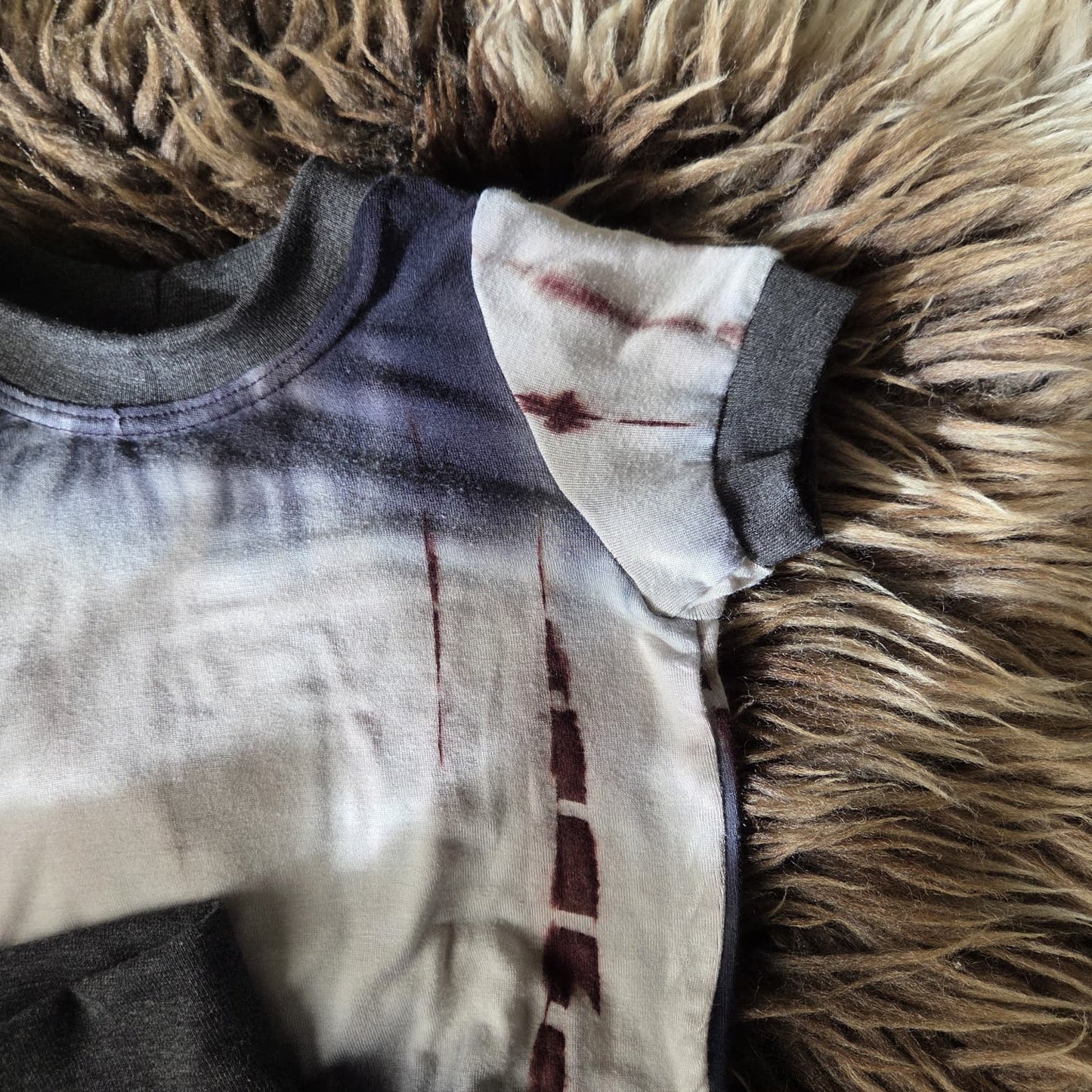 detail van boordje aan mouw bij setje voor wasbare luiers.